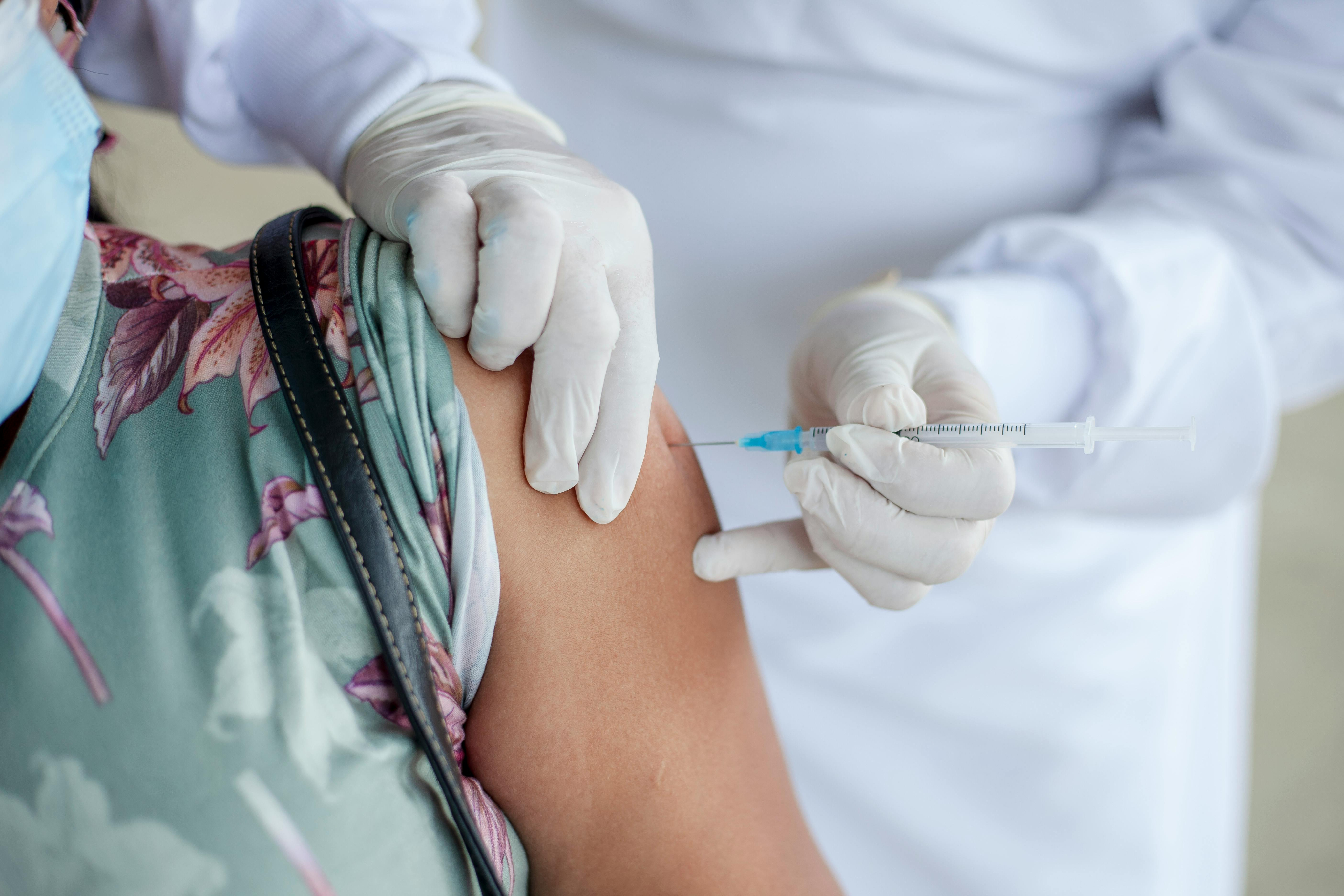 Healthcare professional administering vaccine for immunization