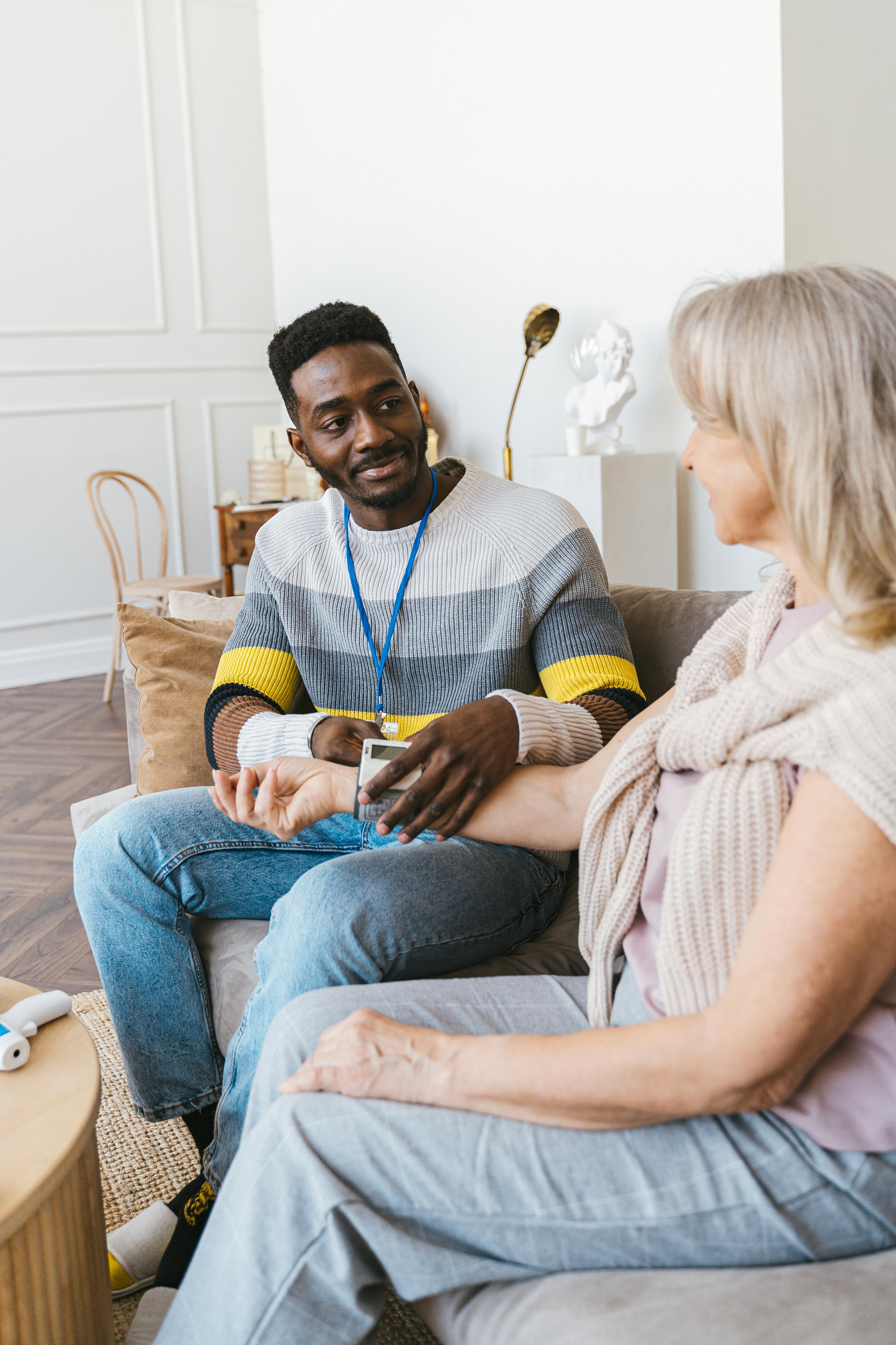 Healthcare team speaking with patient in comfortable setting